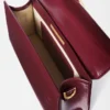 Duża torebka Bambino Cross-body z metalową klapką
