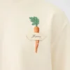 Koszulka z nadrukiem marchewki Koszulka z logo i naszywką w kształcie marchewki Koszulka z nadrukiem marchewki Koszulka z logo i naszywką w kształcie marchewki